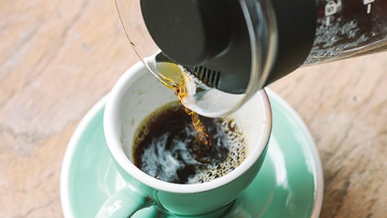 Image of Coffee Pot Pouring in Cup