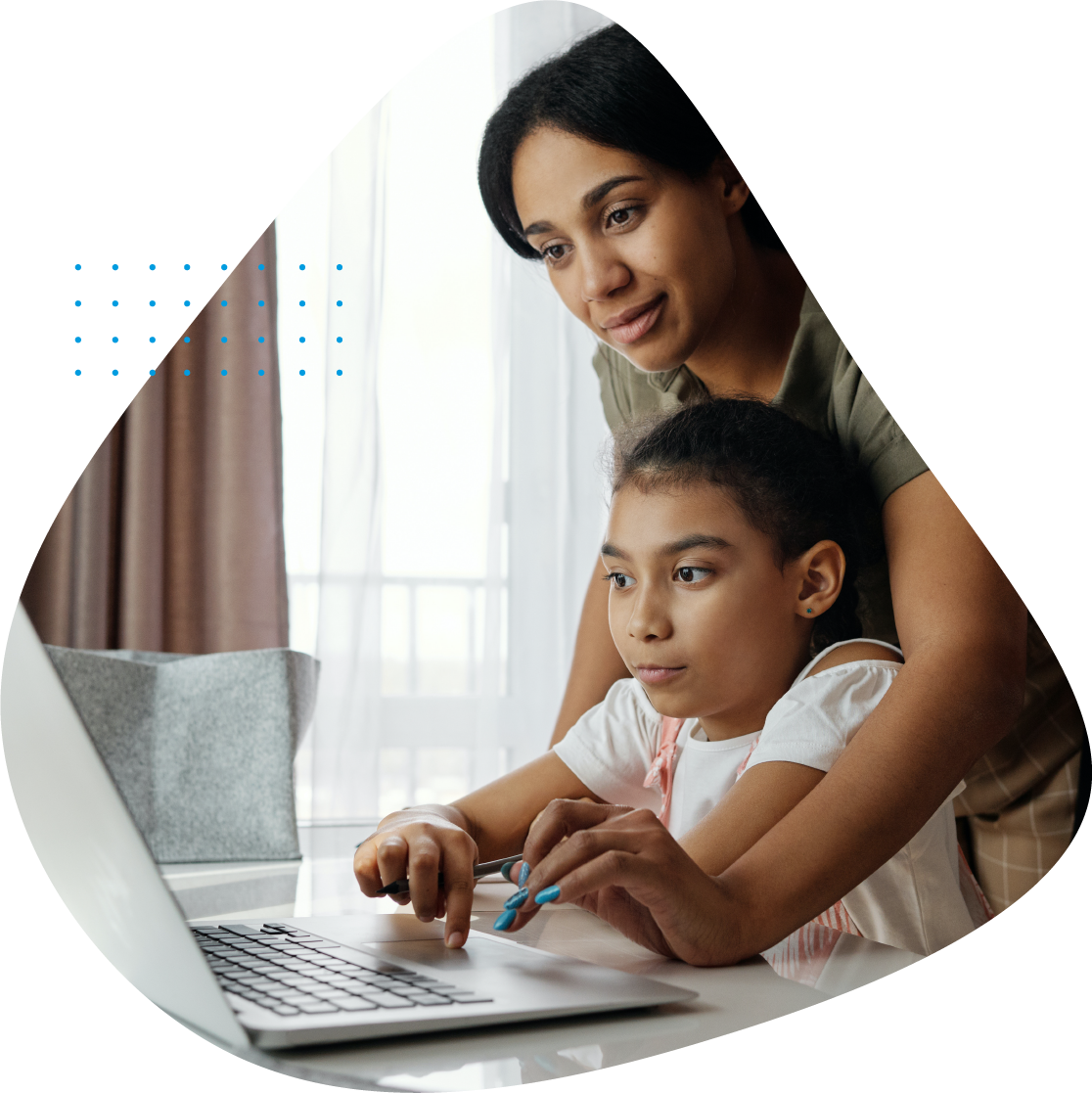 Mother helping child on a computer
